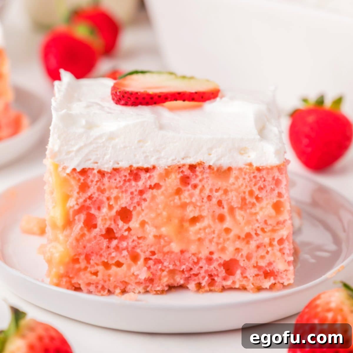 Velvety Strawberry Poke Cake Bliss 1 featured 180355