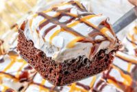Loaded Snickers Poke Cake