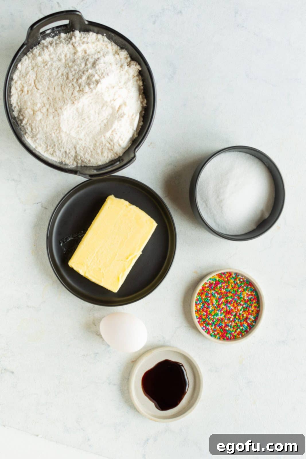 Ingredients needed: Unsalted butter, superfine sugar, egg, vanilla extract, all-purpose flour, salt, nonpareils, purple, yellow, red, orange, blue, and green gel food coloring and egg white.