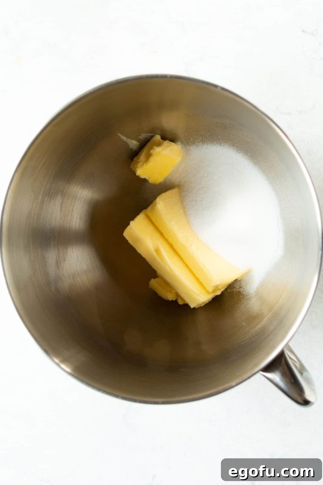 Butter and sugar in bowl of stand mixer.