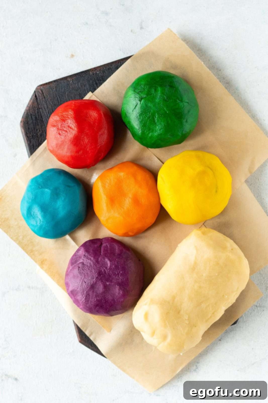 Six of the dough balls colored with one dough left the same.