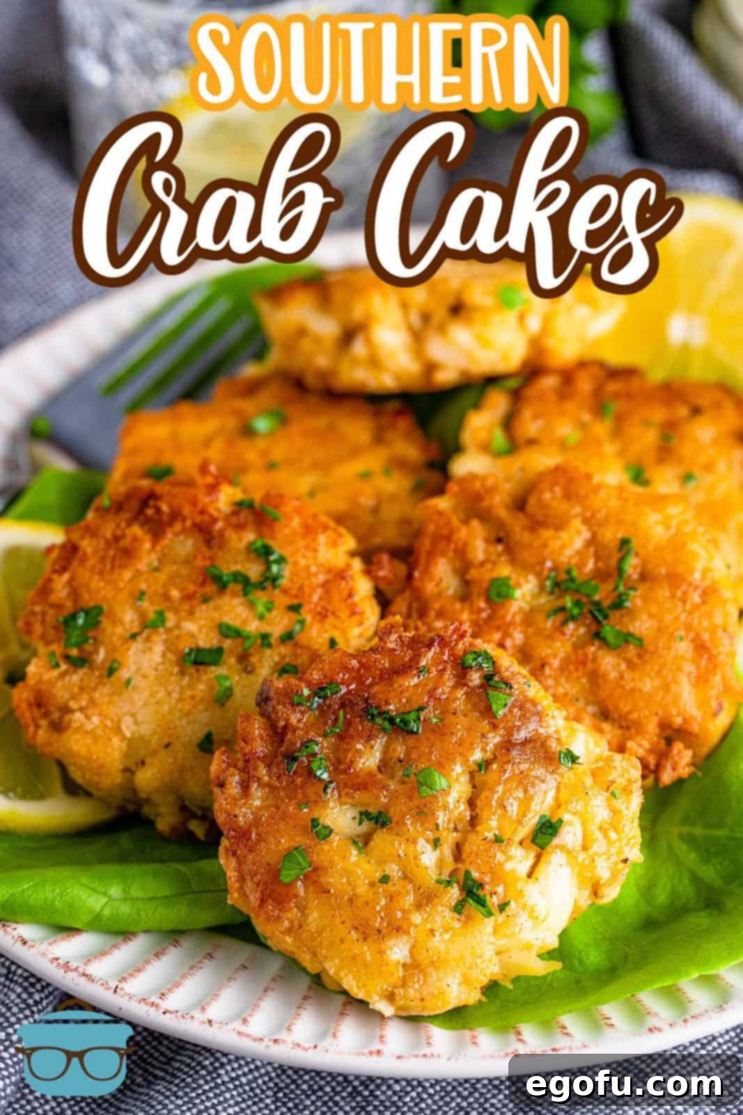 Lowcountry Crab Delights 3 Pinterest image of stacked Southern Crab Cakes on lettuce on white plate.