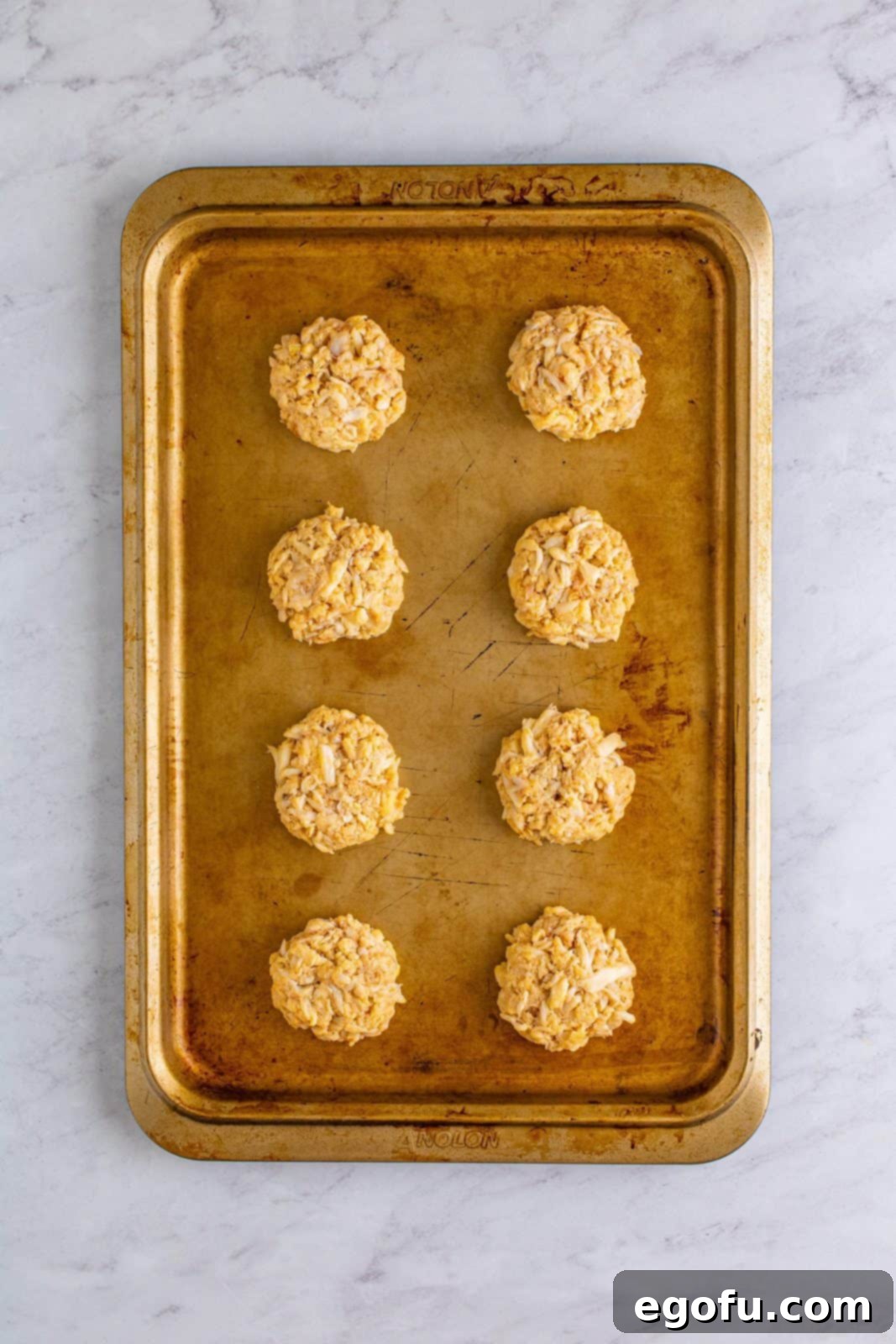 Lowcountry Crab Delights 6 Crab Cakes formed and placed on a sheet tray.