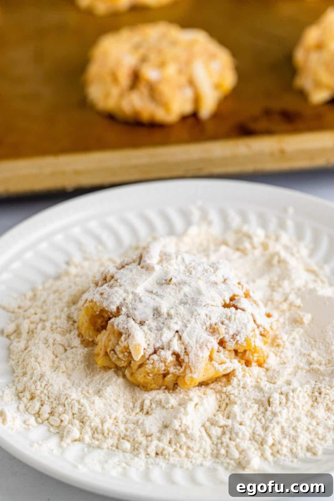 Lowcountry Crab Delights 7 Remaining flour added to plate and patties being dredged in it.