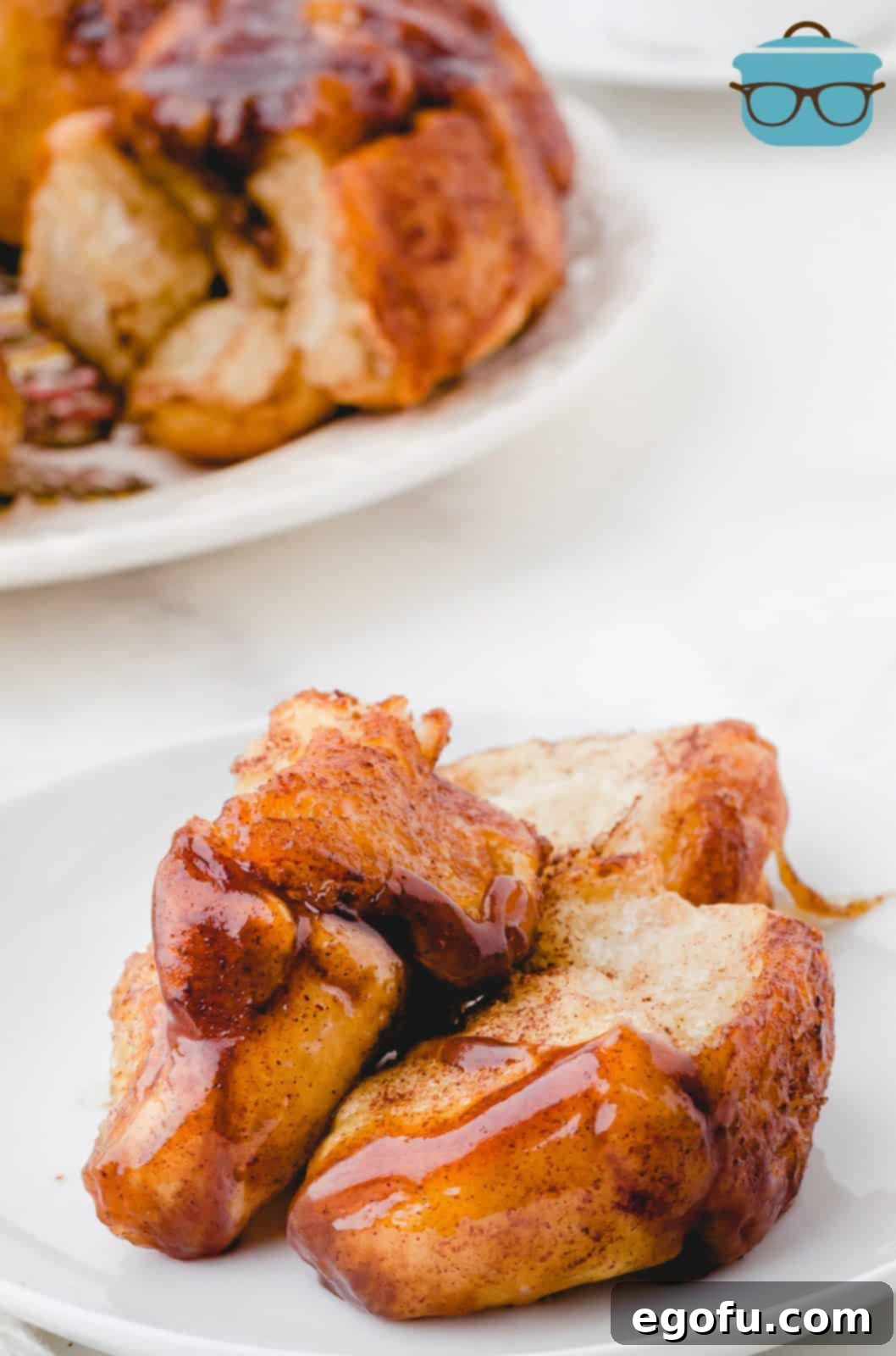 Pieces of Easy Monkey Bread pulled off onto plate.