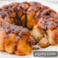 Square image of Easy Monkey Bread close up with some bread removed.