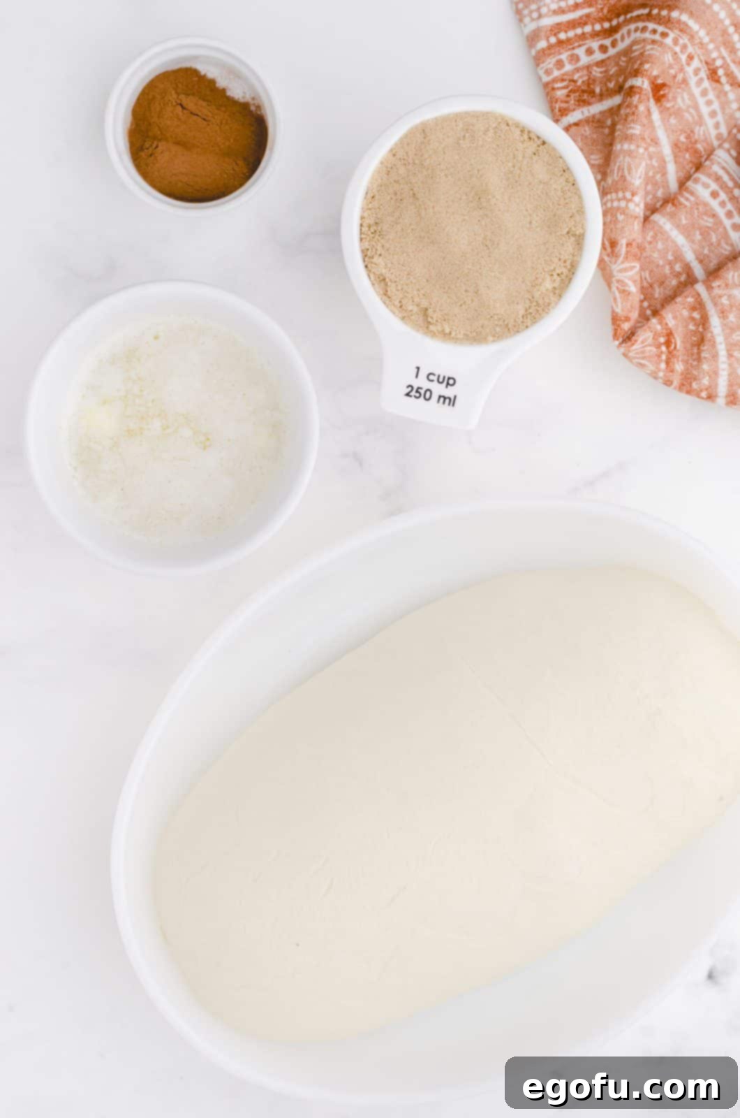 Ingredients needed: frozen bread dough, melted butter, brown sugar, cinnamon and chopped pecans (optional). 