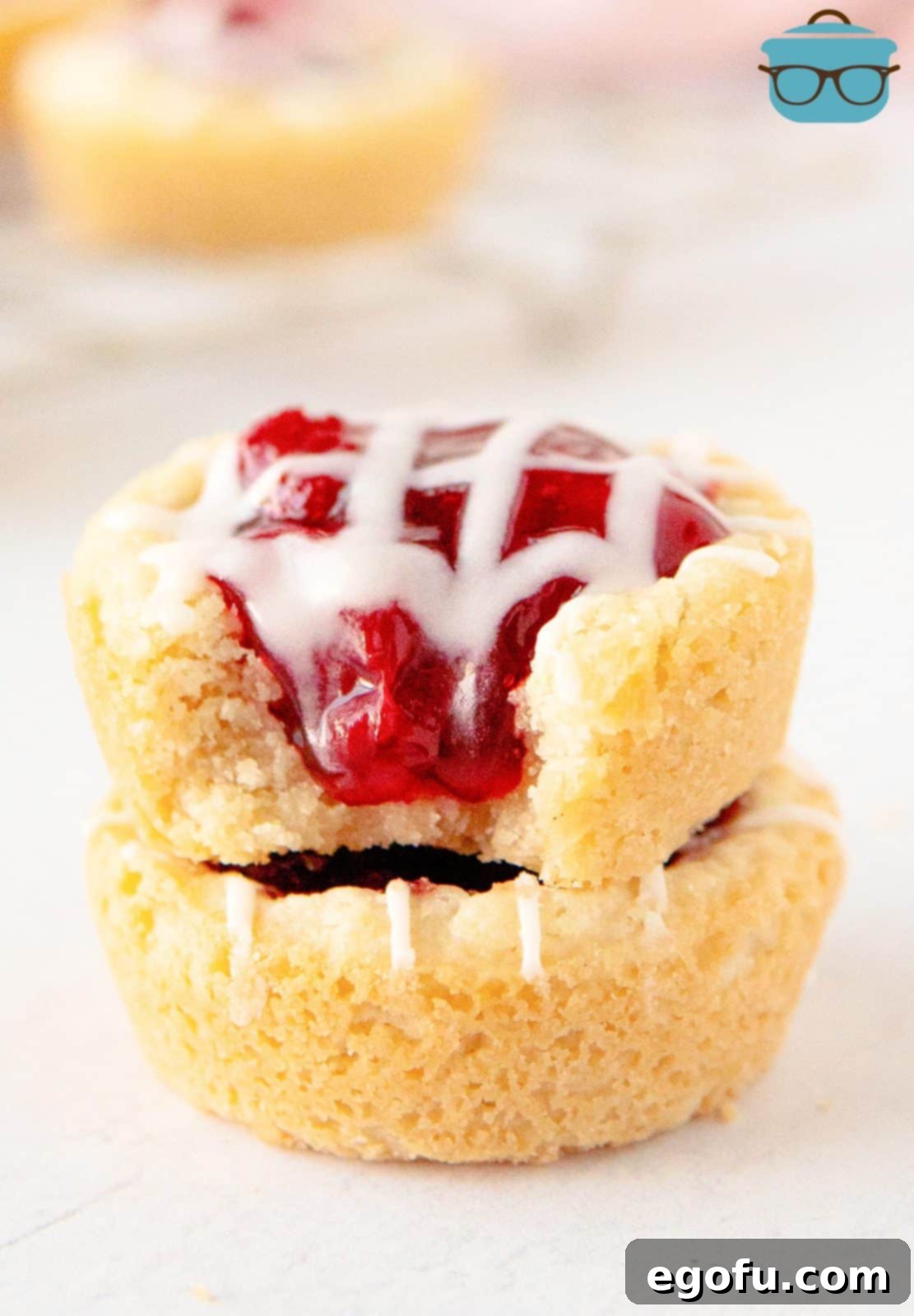 Strawberry Cookie Delights 2 Two stacked Strawberry Cookie Cups with bite taken out of top one.