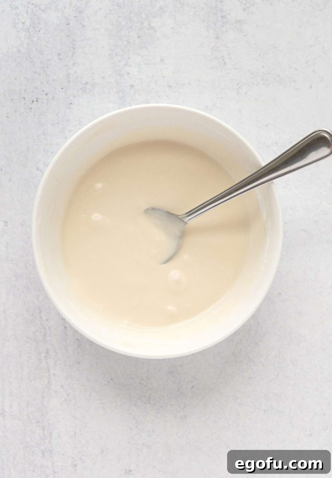 Strawberry Cookie Delights 5 Glaze mixture mixed together in white bowl.