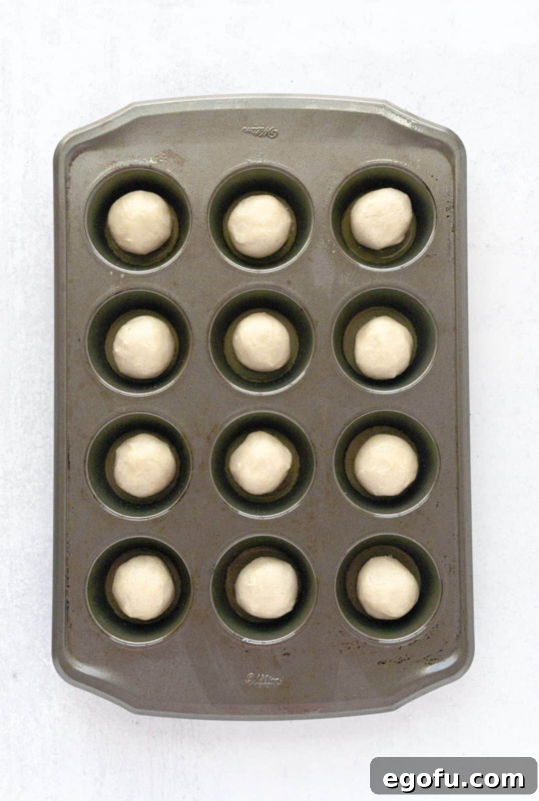 Strawberry Cookie Delights 6 Cookie dough placed into muffin tin.