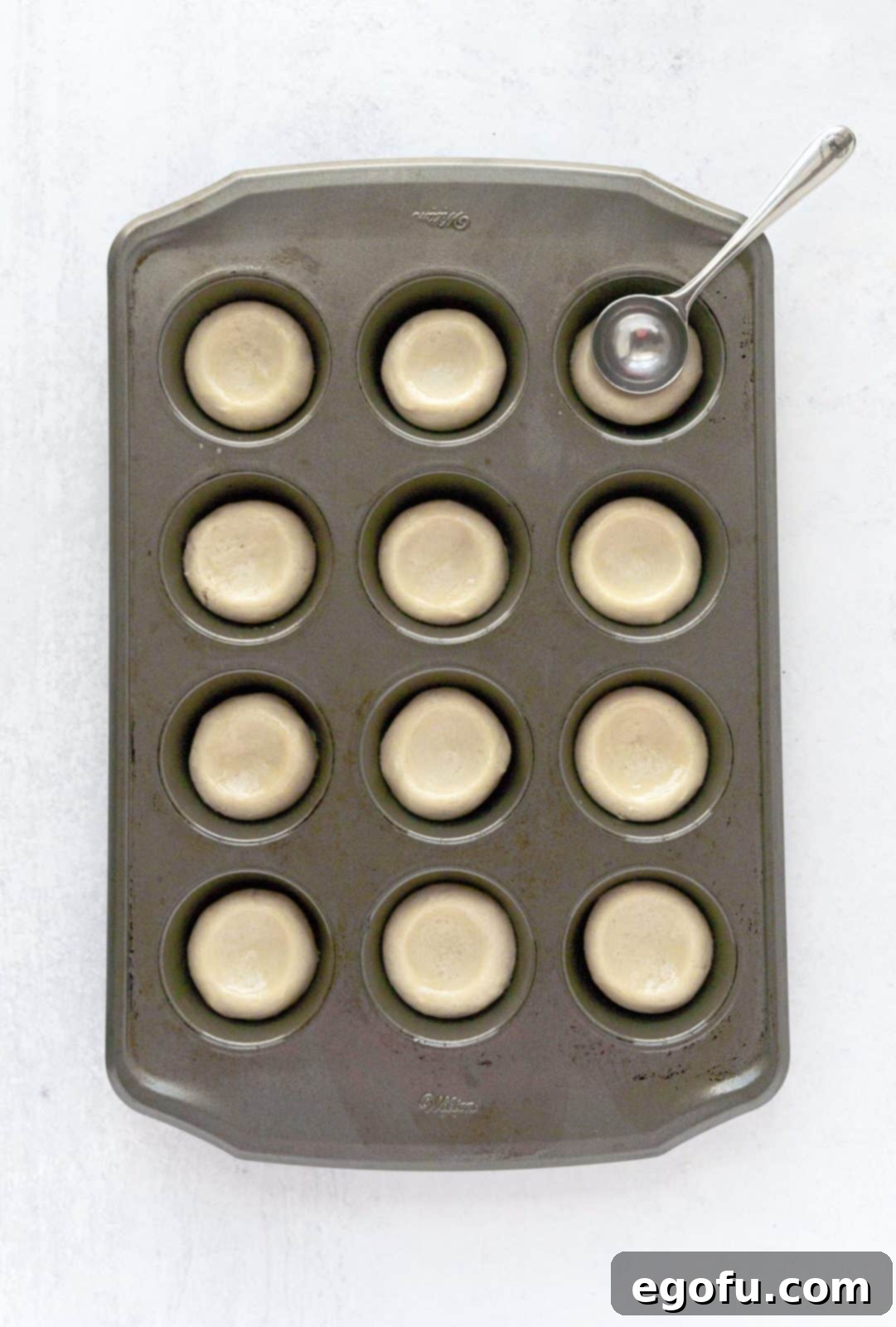 Strawberry Cookie Delights 7 Tablespoon pressing indents into the cookie dough.