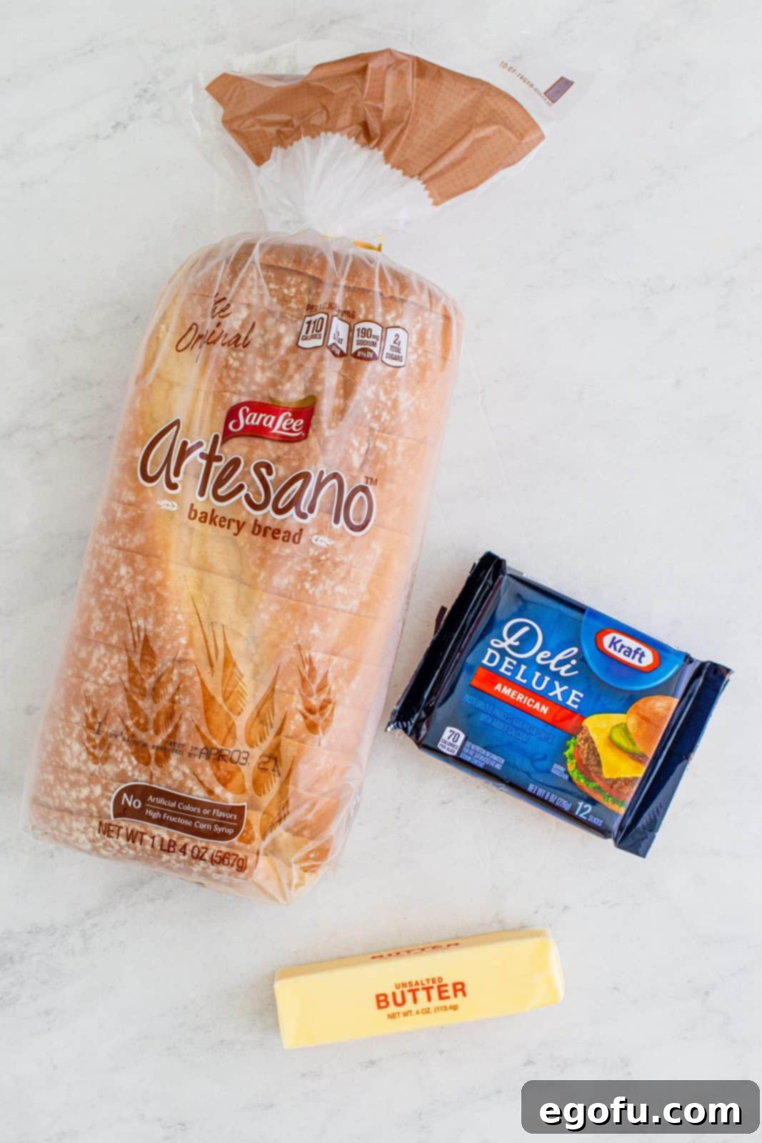 Air Fryer's Golden Crispy Grilled Cheese 4 Ingredients needed: white bread, unsalted butter and american cheese.