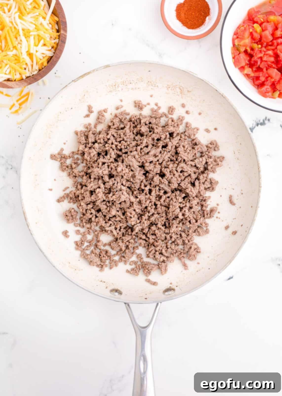 Zesty Taco Roll-Ups 5 Ground beef, finely minced onion, and garlic sizzling together in a pan, cooking down to a rich, savory base.