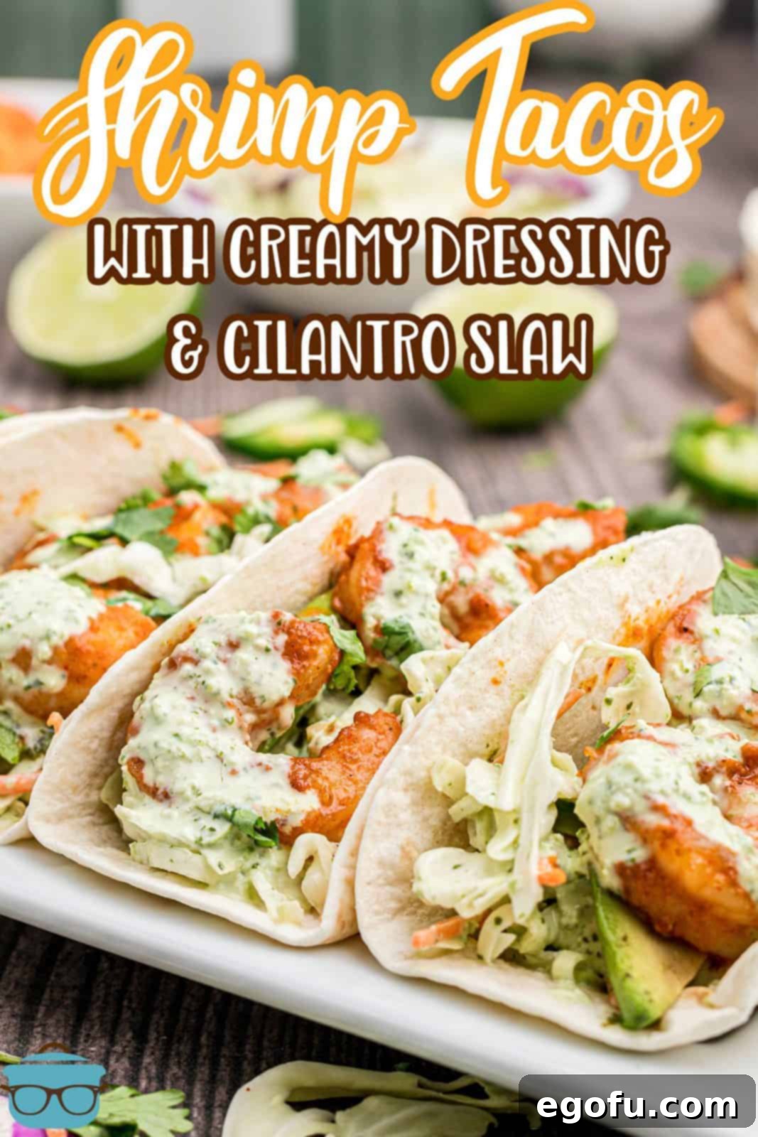 Pinterest image of Shrimp Tacos on white platter topped with slaw.