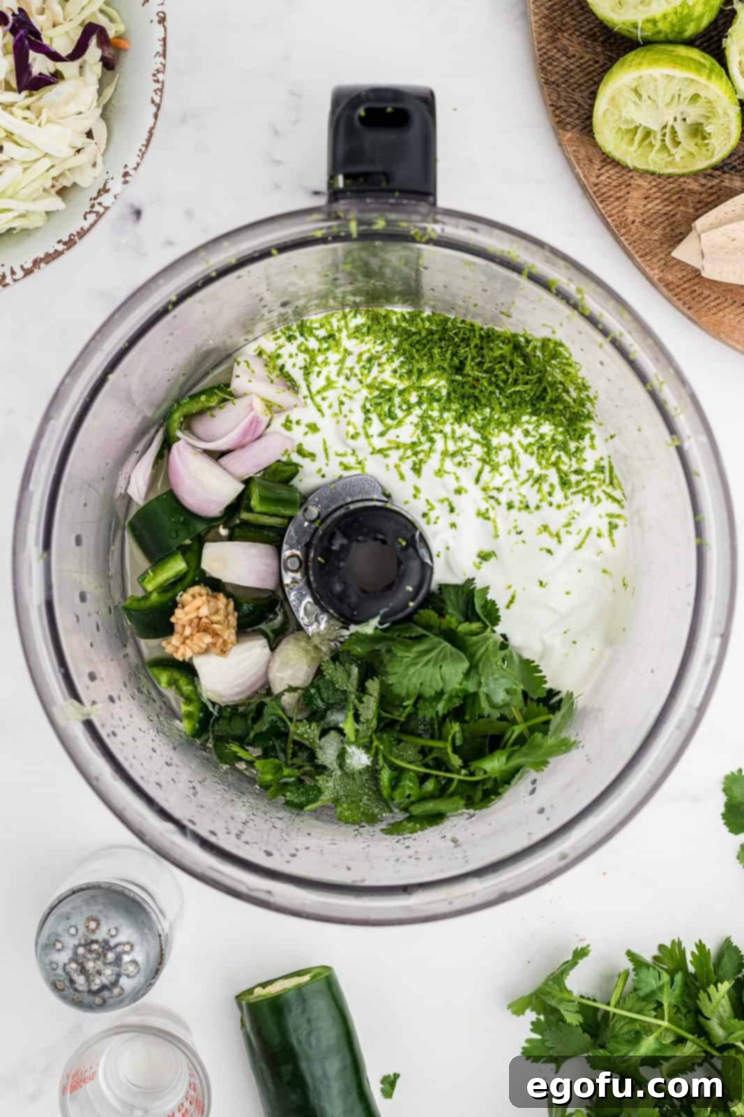 Sauce ingredients added to food processor.