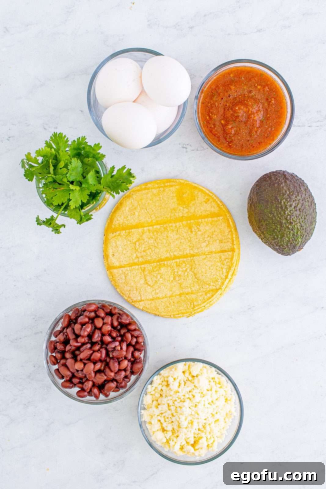 Zesty Ranch Morning Stack 3 Ingredients needed: corn tortillas, eggs, black beans or 1/2 cup refried beans and optional toppings, laid out for a recipe.