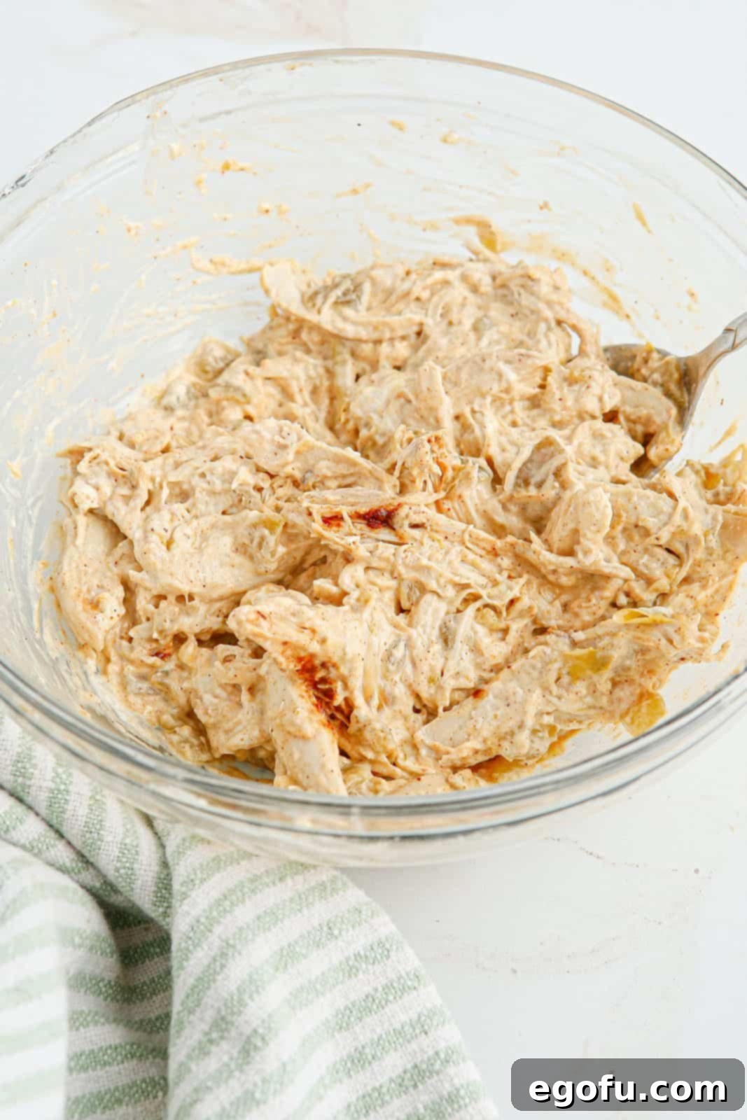 Chicken mixture mixed up in bowl.