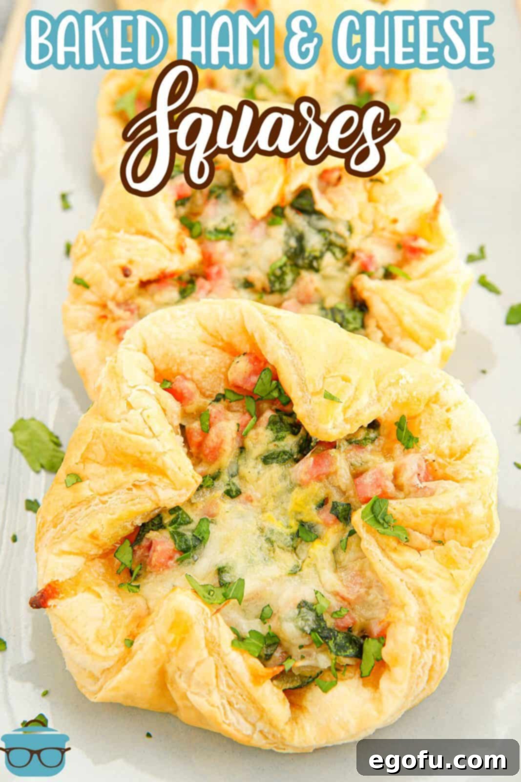 Overhead image of layered Baked Ham and Cheese Squares on white platter, perfect for Pinterest.