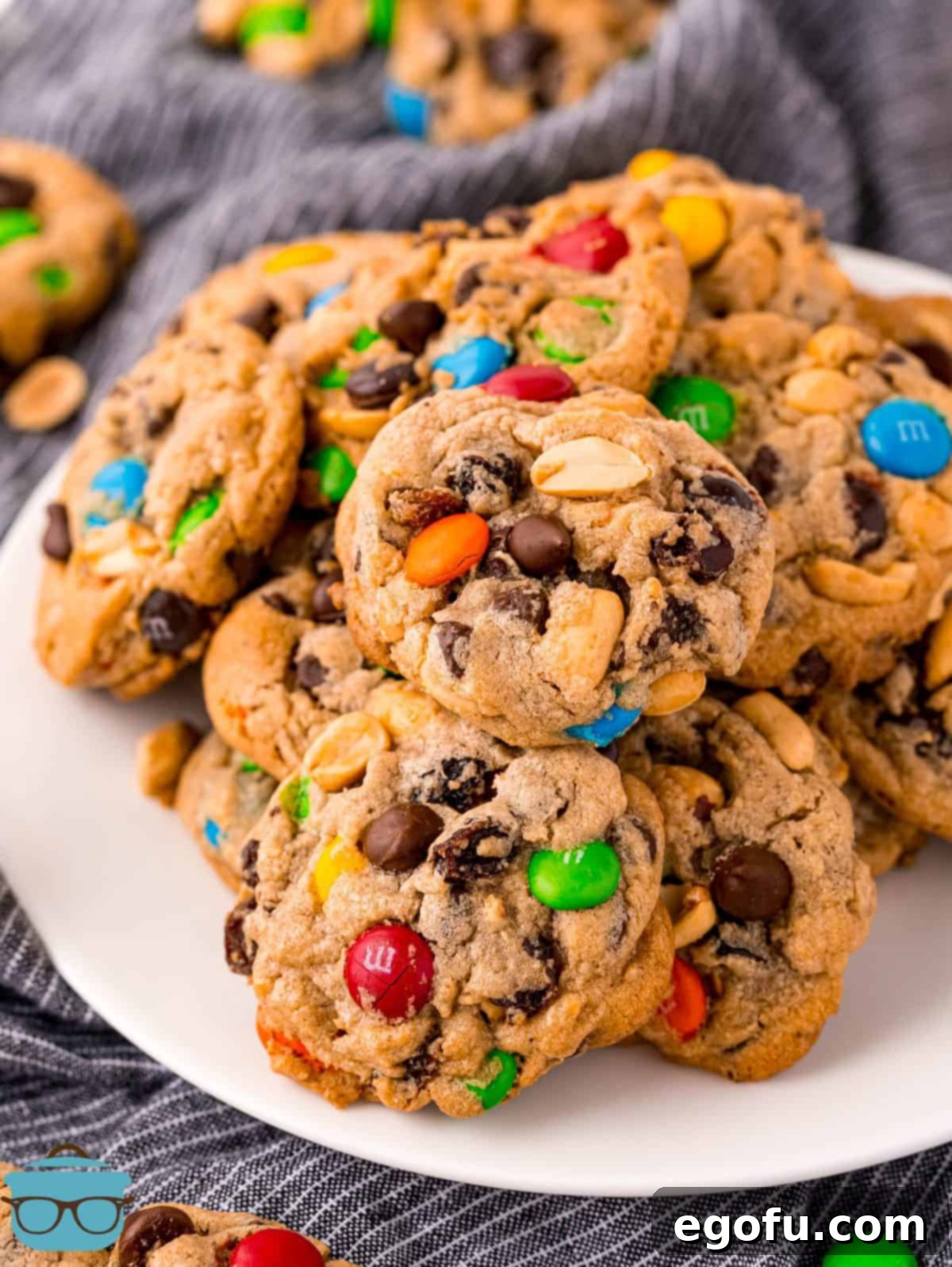 Trail Mix Cookies stacked on white plate.