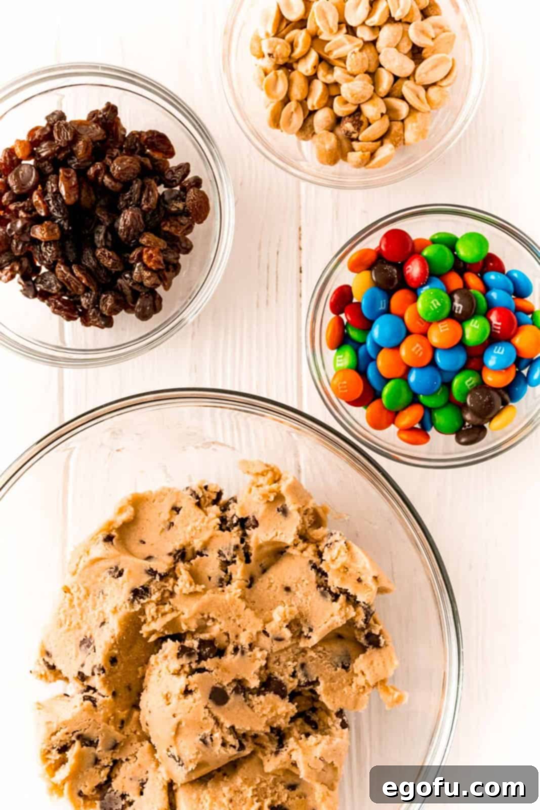 Ingredients needed: refrigerated chocolate chip cookie dough, M&M’s, salted dry roasted peanuts and raisins.