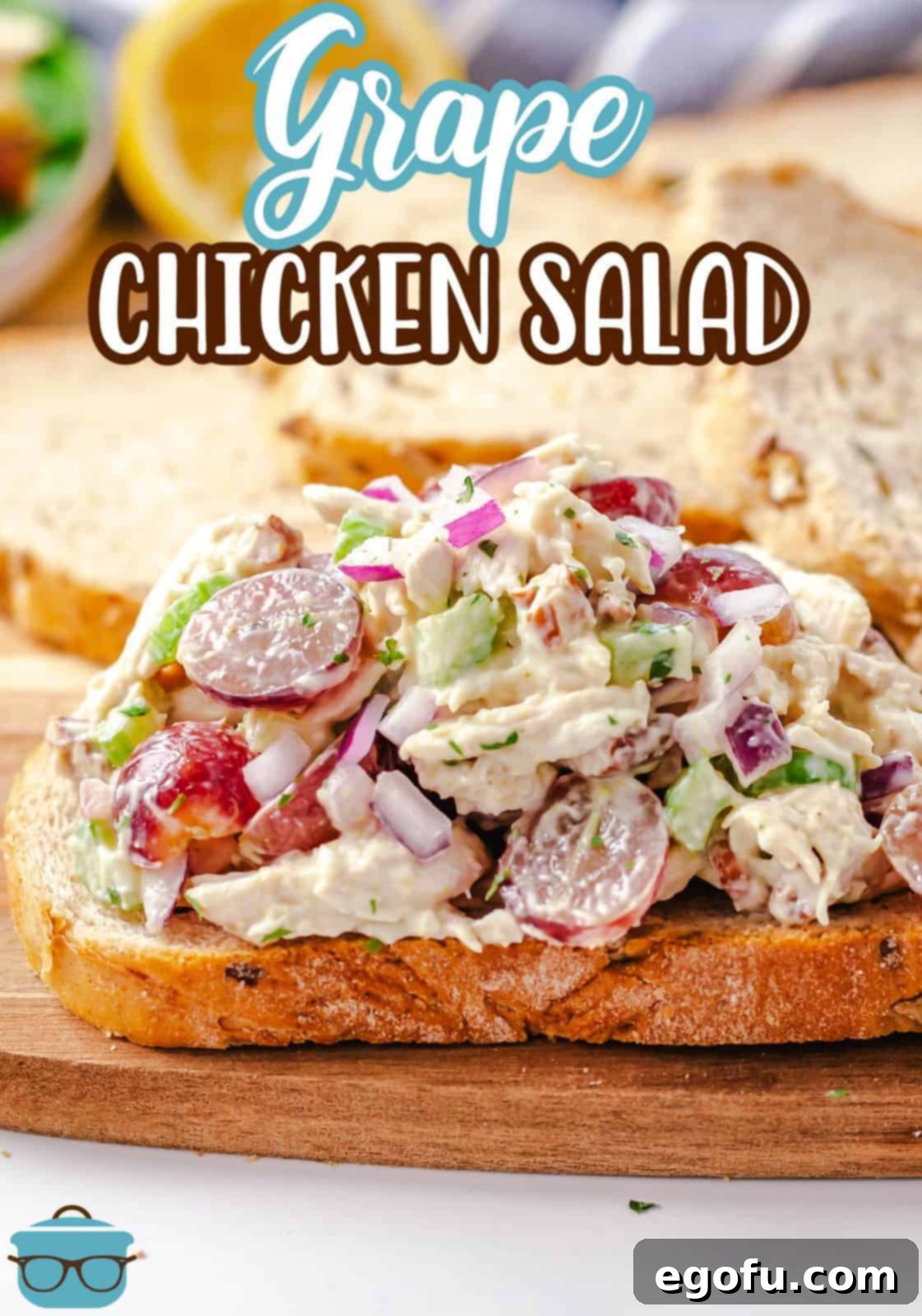 Close-up Pinterest image of Grape Chicken Salad served open-faced on toasted bread, showcasing the rich texture and ingredients.