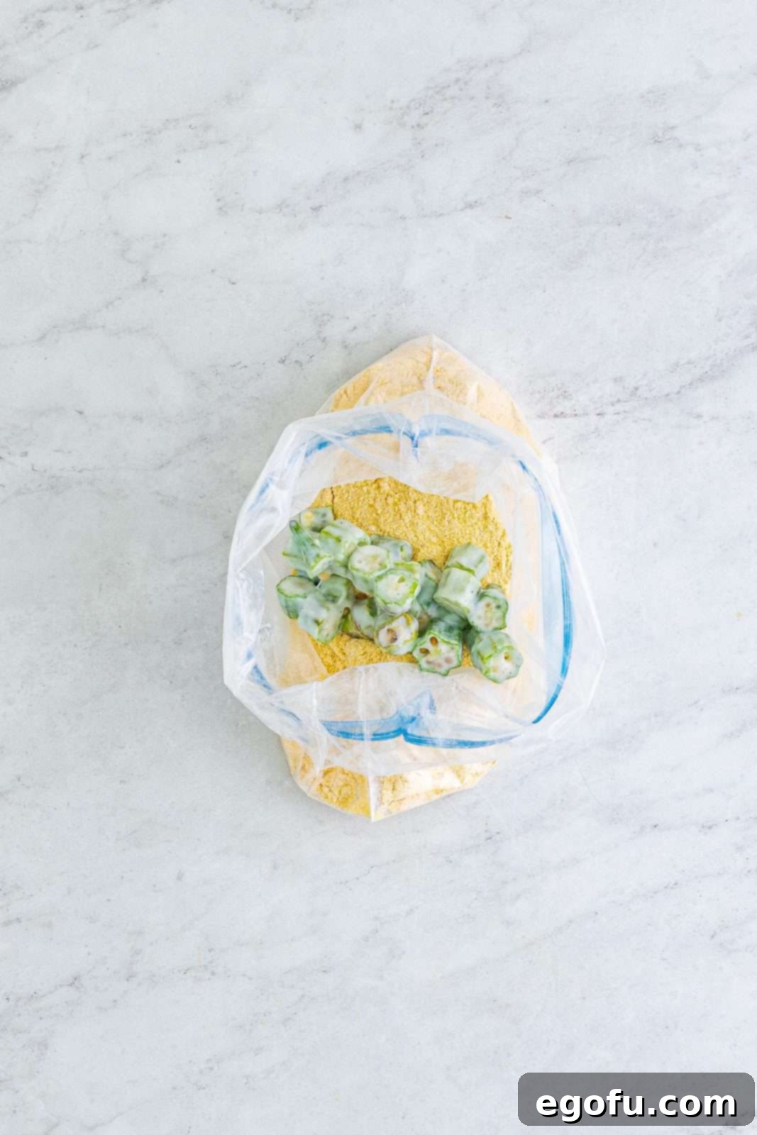 Soulful Crispy Okra 9 Okra added to the flour and cornmeal mixture in bag.