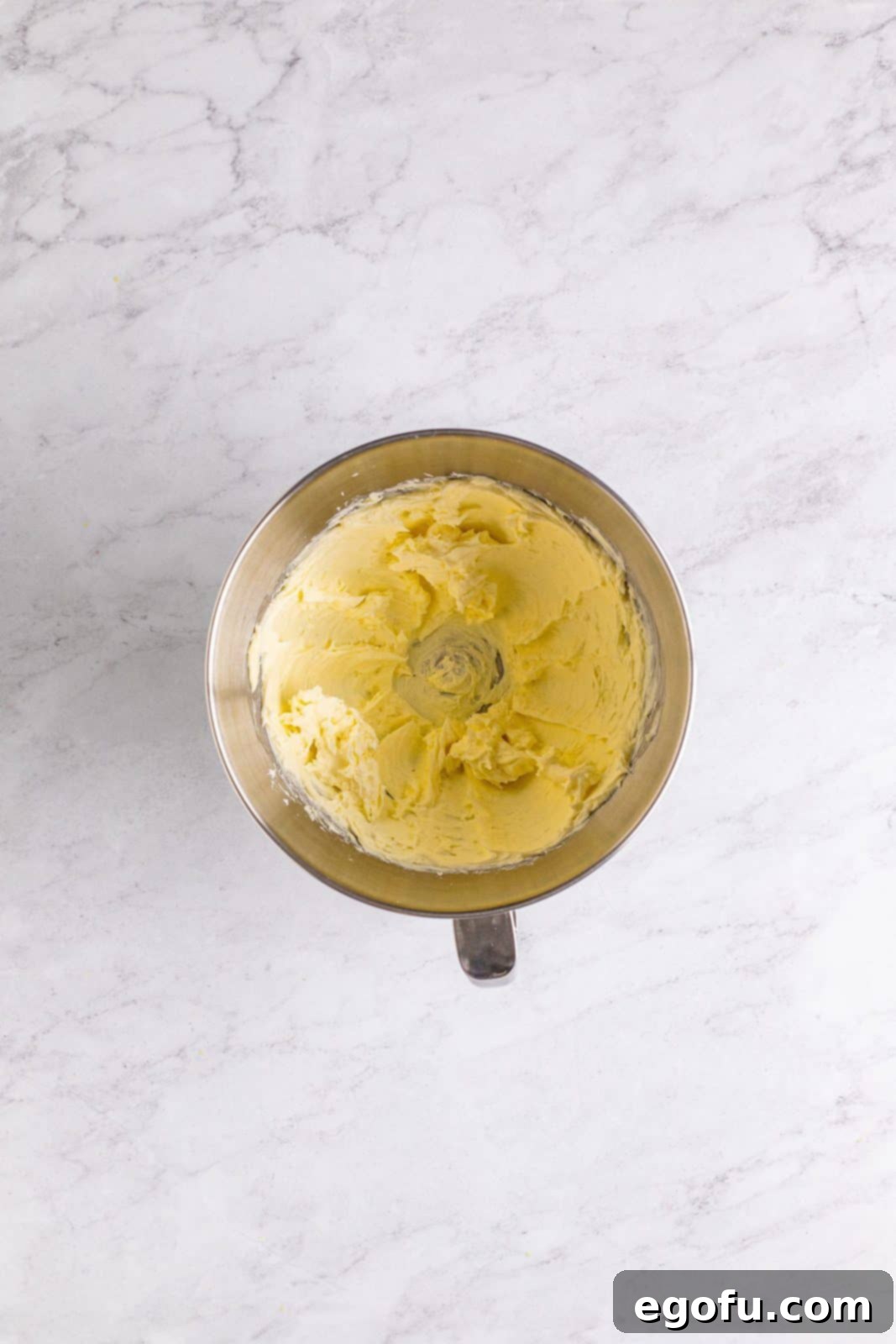 Southern Sunshine Cake 13 Cream cheese and butter beaten in bowl of stand mixer.