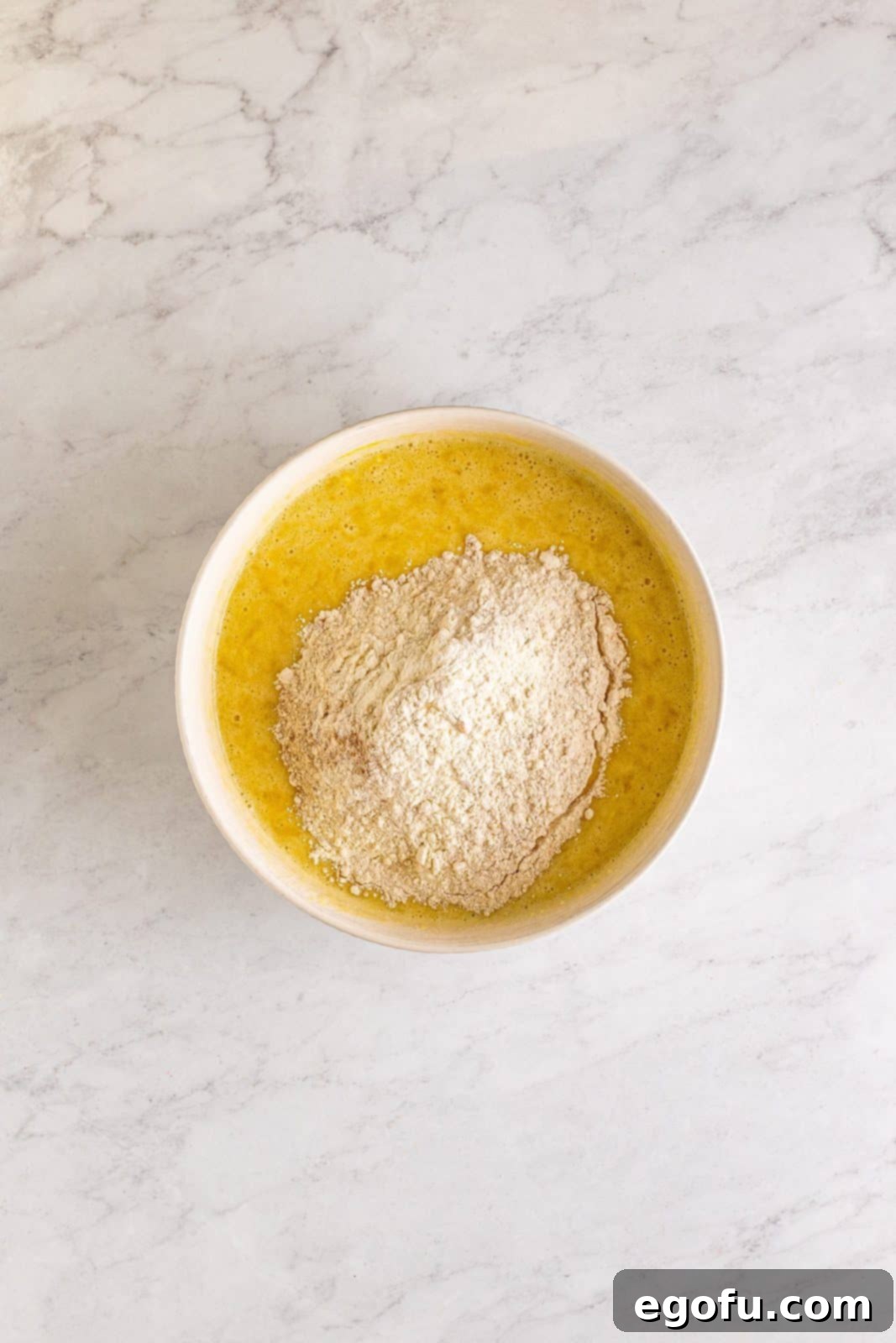 Southern Sunshine Cake 9 Dry ingredients added to wet ingredients.