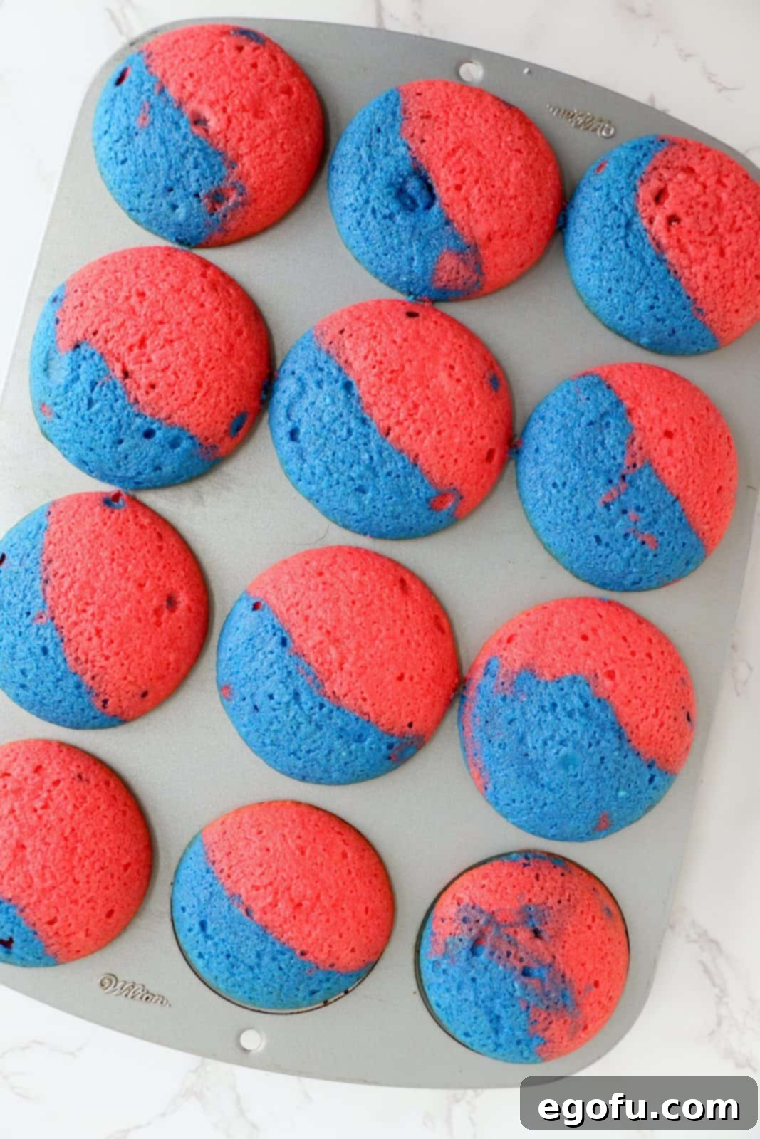 Finished cupcakes out of oven cooling.