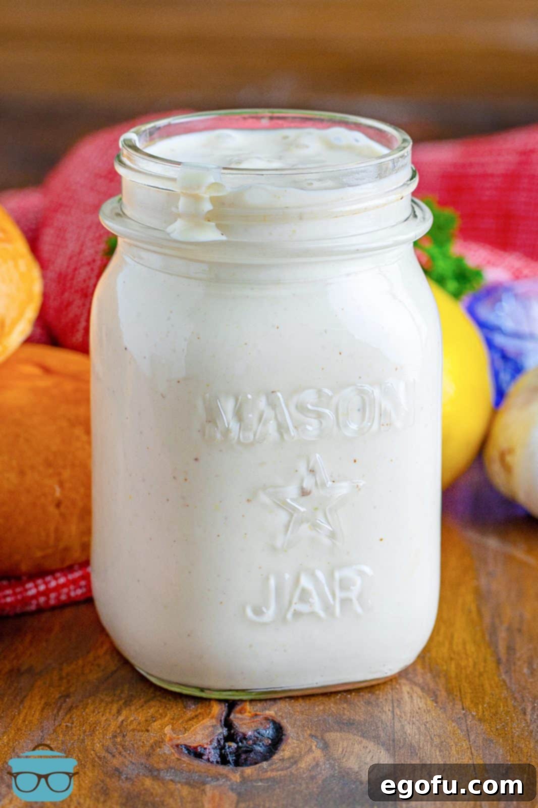 The South's Signature White BBQ 2 Close up of mason jar with Alabama White Sauce in it.