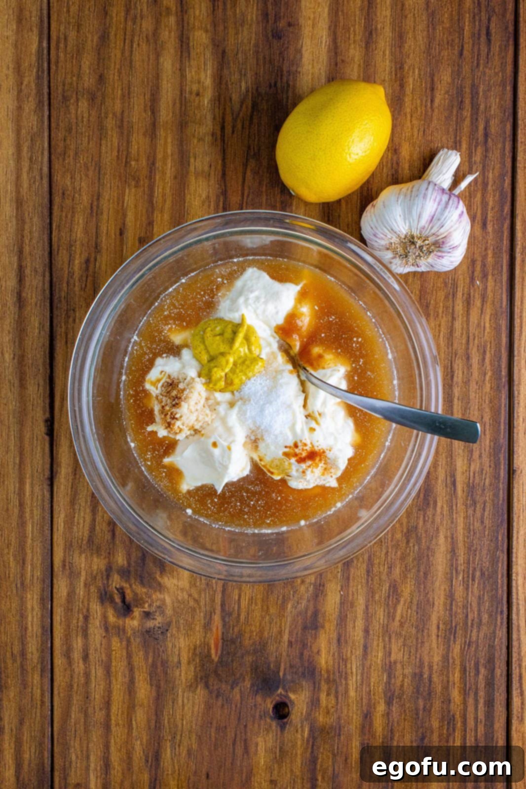 The South's Signature White BBQ 5 All ingredients in clear bowl ready to be mixed together.