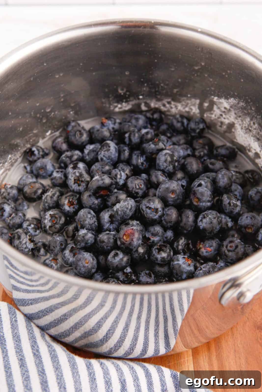 Blueberries, water, lemon juice and vanilla added to the sugar and cornstarch mixture.