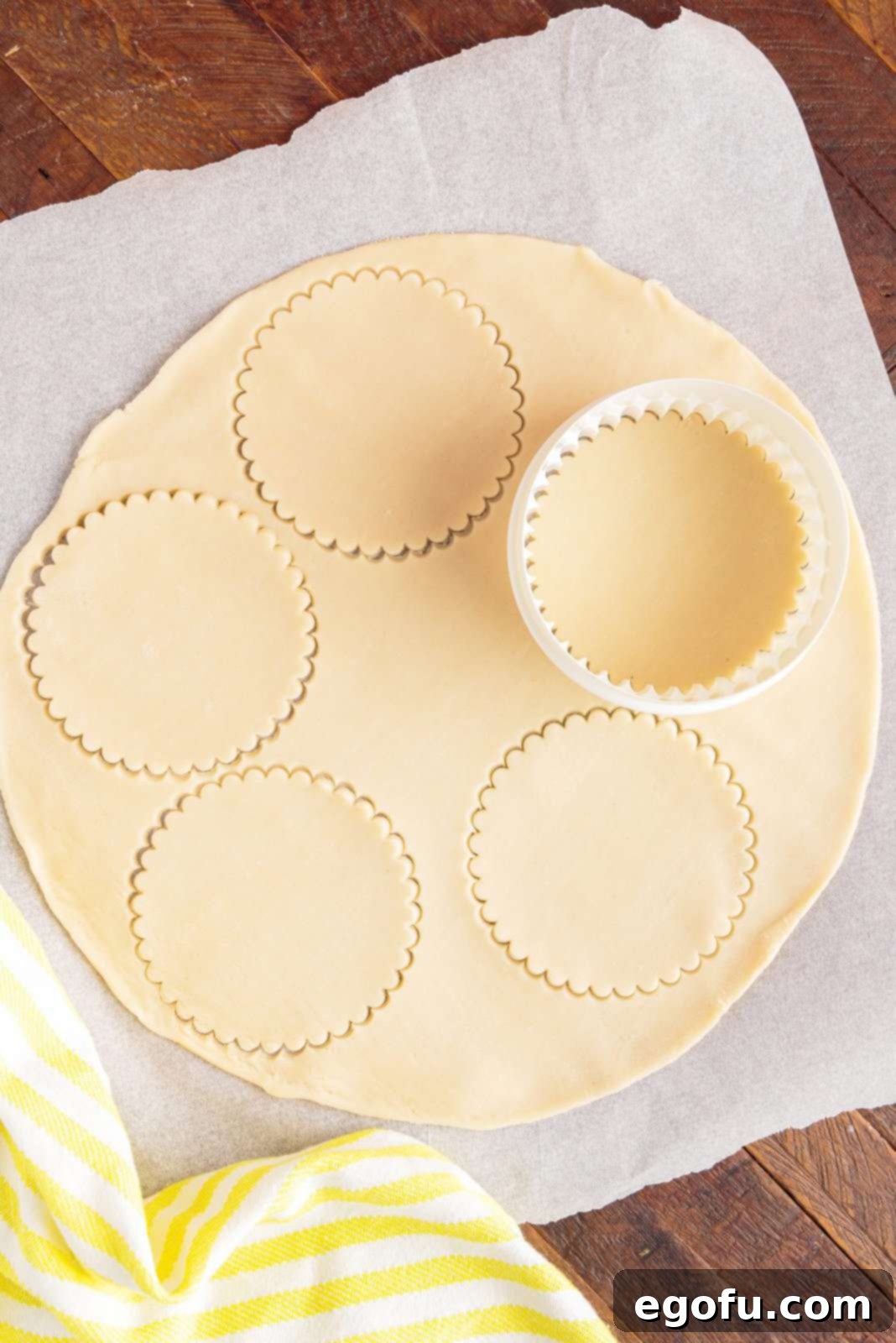 Cutter cutting out circles in pie crust.