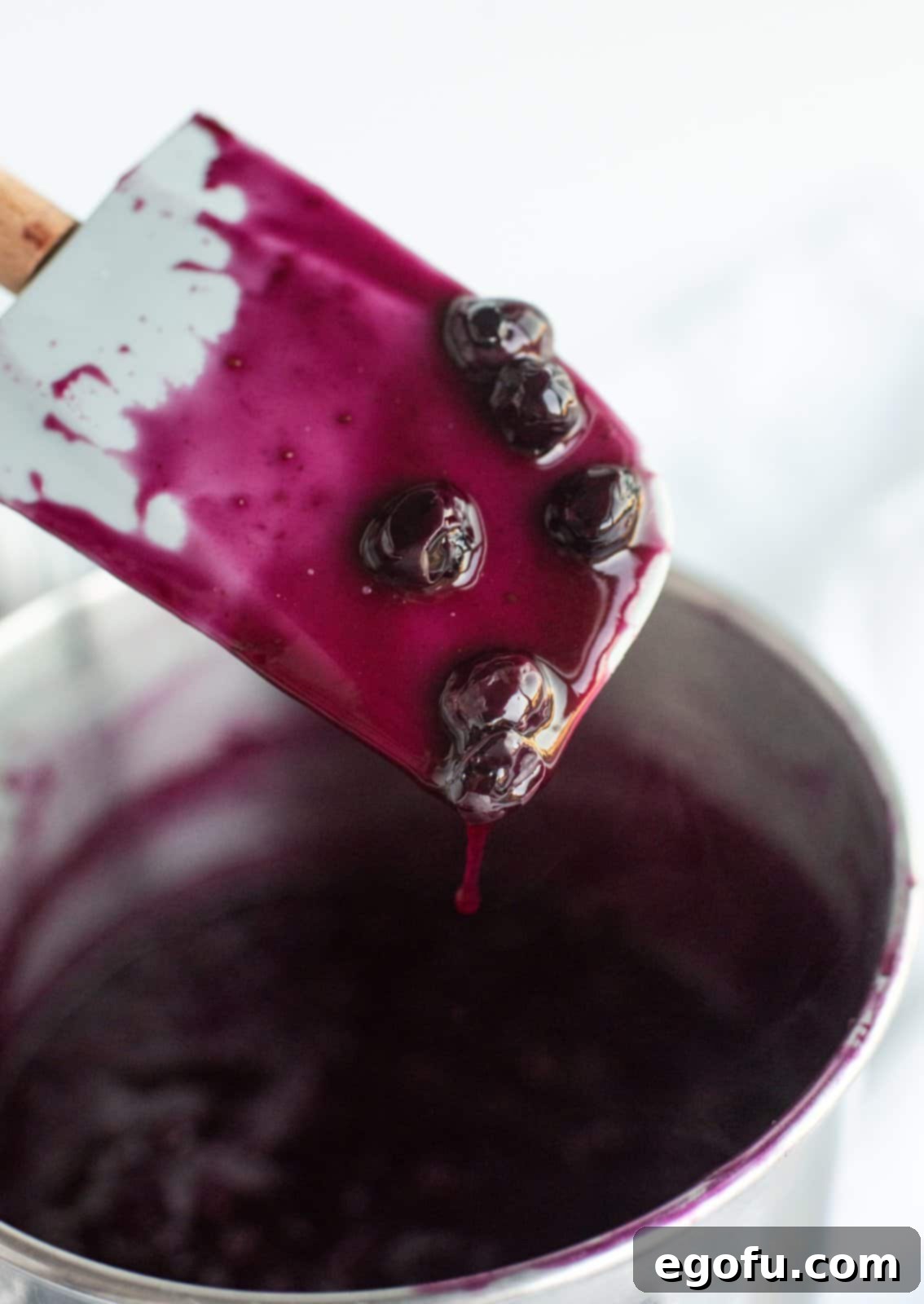 Blueberry sauce made up in pan.
