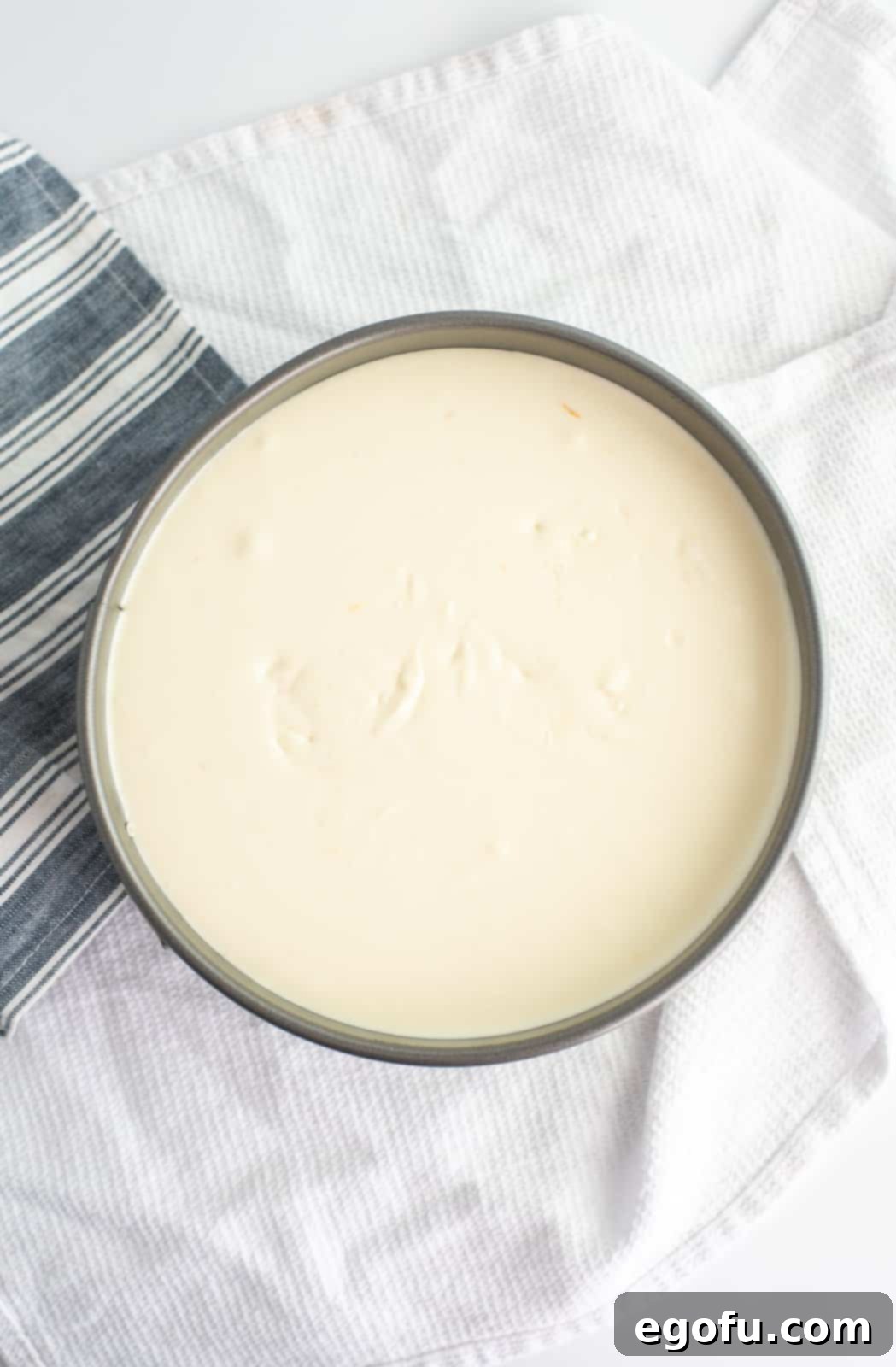 Cheesecake mixture poured into springform pan.