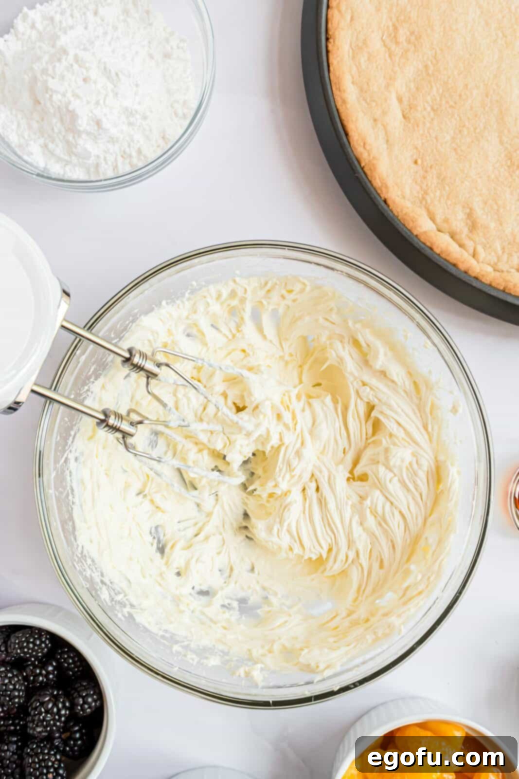 Butter and cream cheese beaten together in bowl.