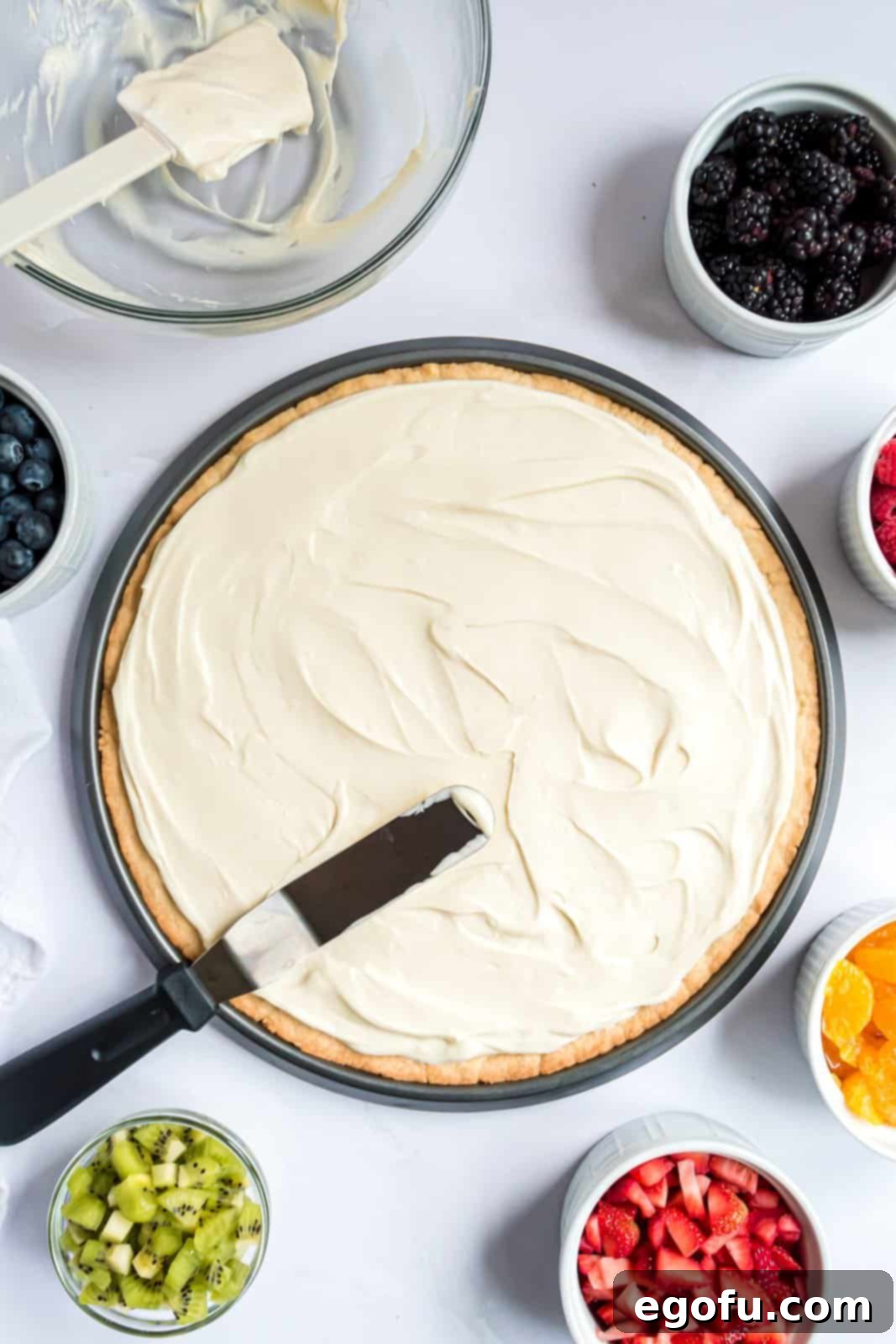 Cream cheese mixture spread over crust.