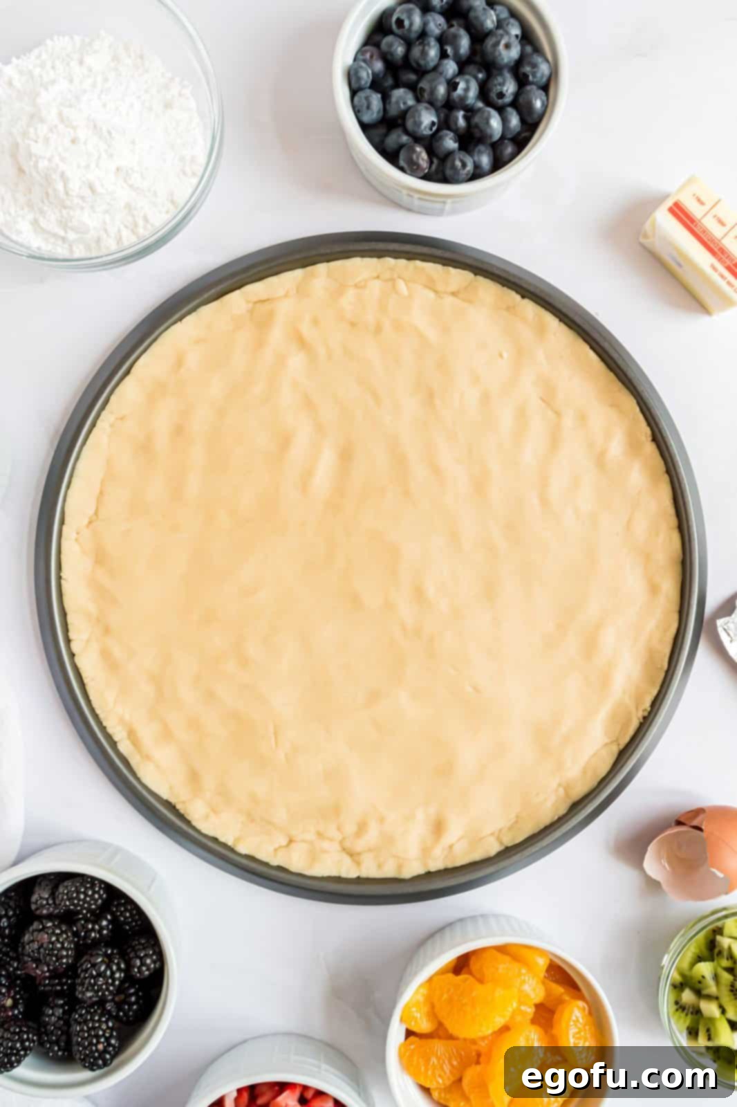 Dough pressed into round cookie sheet.