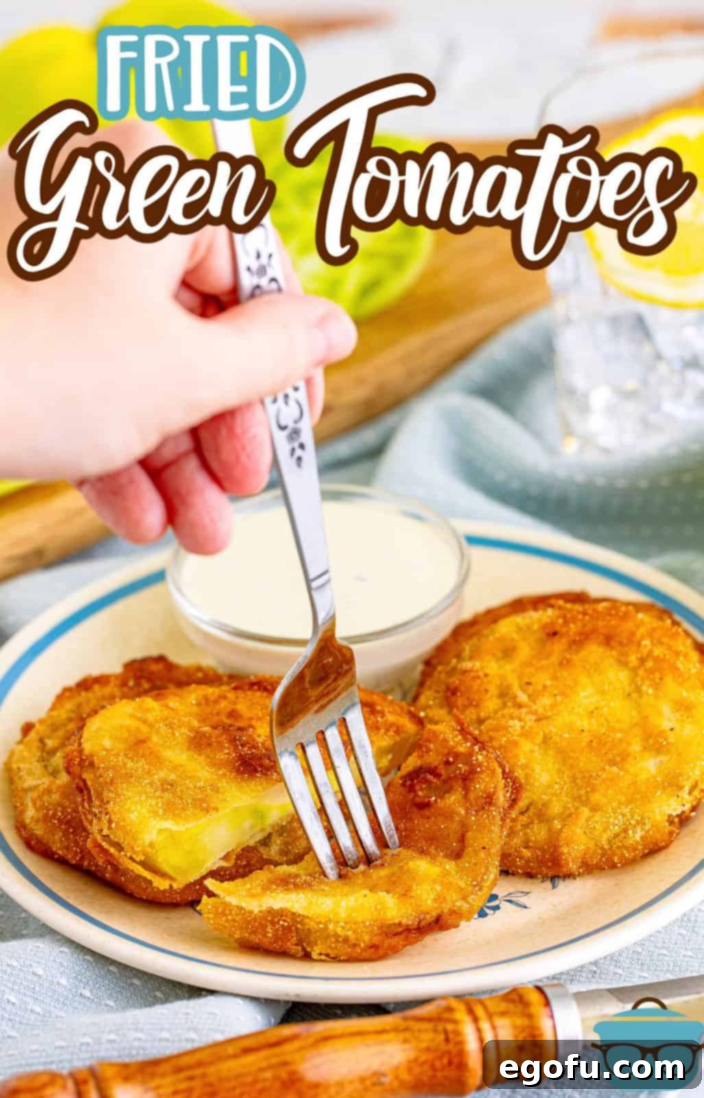 A fork piercing a single crispy Fried Green Tomato on a white plate, highlighting its golden texture and inviting taste, a perfect close-up for Pinterest sharing.