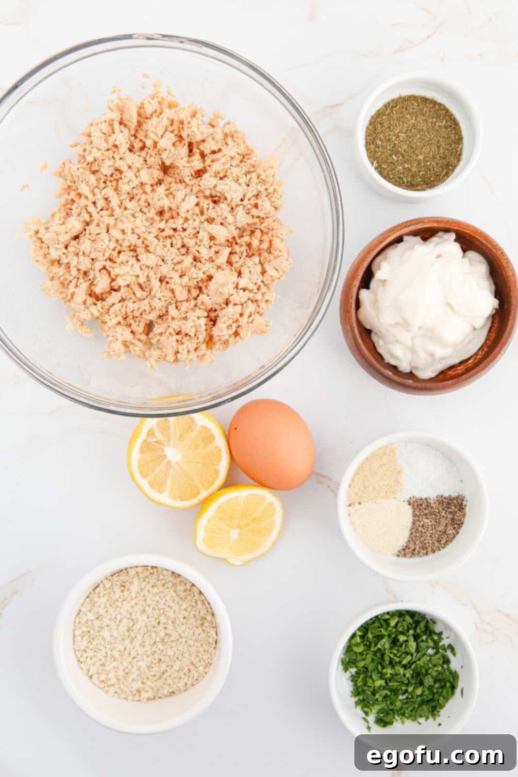Crispy Air-Fried Salmon Cakes 5 Ingredients needed: salmon meat, egg, mayonnaise, panko breadcrumbs, lemon juice, dried dill, onion powder, garlic powder, salt, pepper, parsley, cooking spray, lemon wedges and tartar sauce.