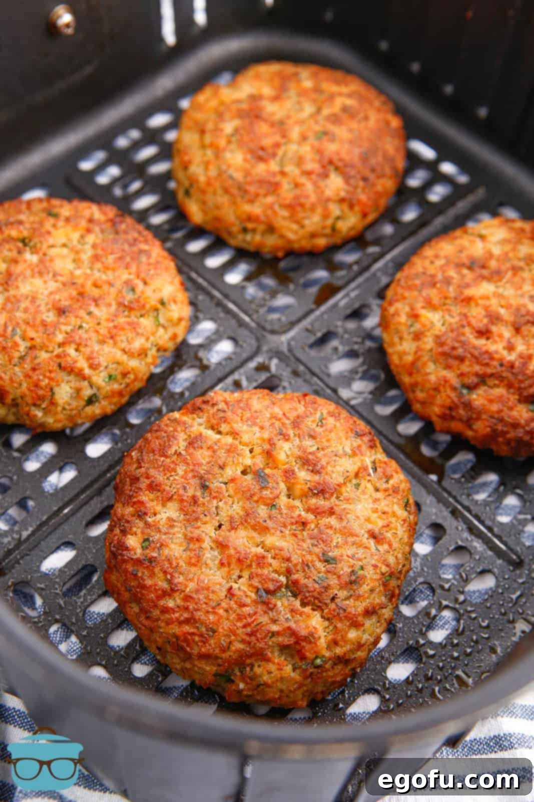 Crispy Air-Fried Salmon Cakes 9 Air Fryer Salmon Patties in air fryer basket finished.