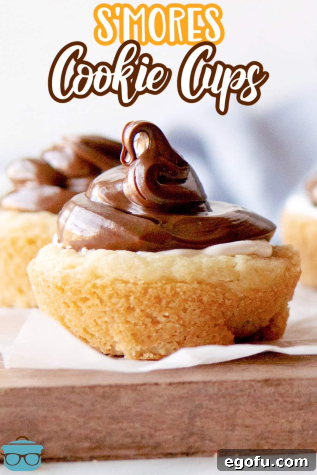 Pinterest image close up of S'mores Cookie Cups showing the nutella on top.