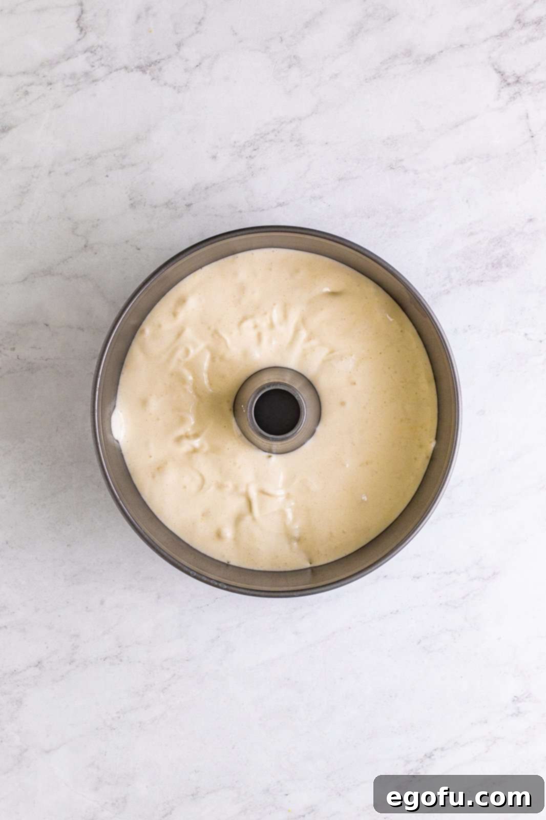 Angel Food Cake batter added to an ungreased tube pan, ready for baking.
