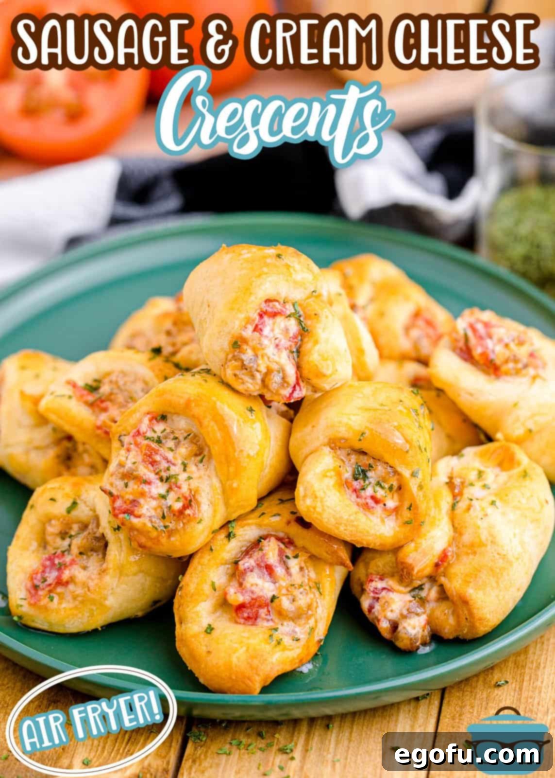 Pinterest image of Air Fryer Sausage and Cream Cheese Crescents on green plate with ingredients in background.