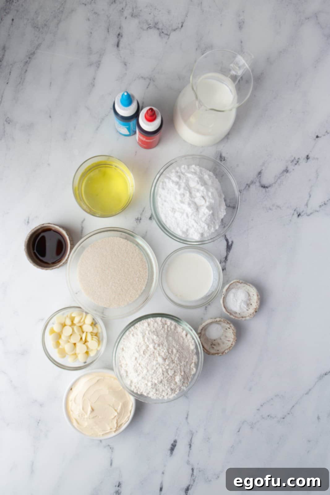 Ingredients needed: butter, granulated sugar, egg whites, baking powder, baking soda, all-purpose flour, vanilla, milk, white chocolate, powdered sugar, whipping cream and food coloring.