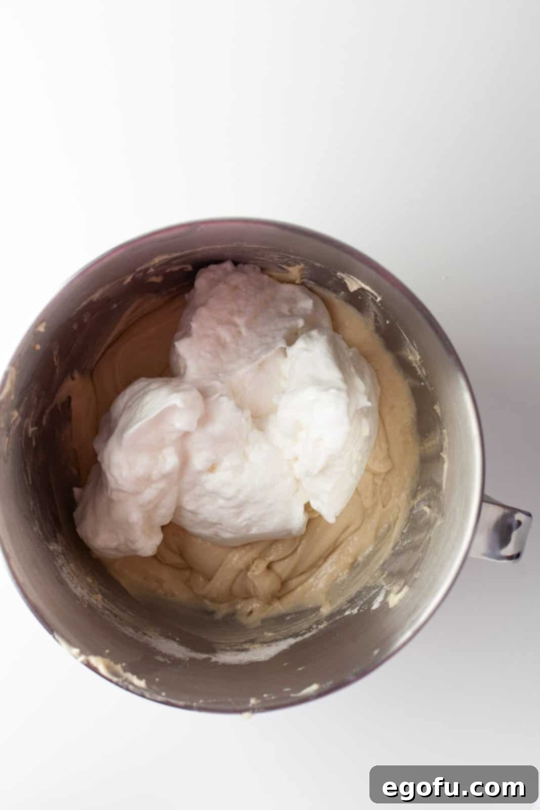 Egg whites added to cupcake batter.