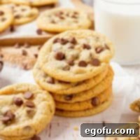 Close-up of a stack of chewy chocolate chip cookies.