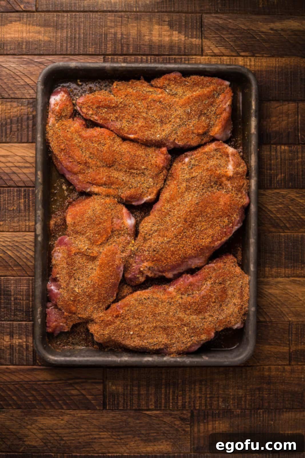 Pork Steaks rubbed with dry rub.