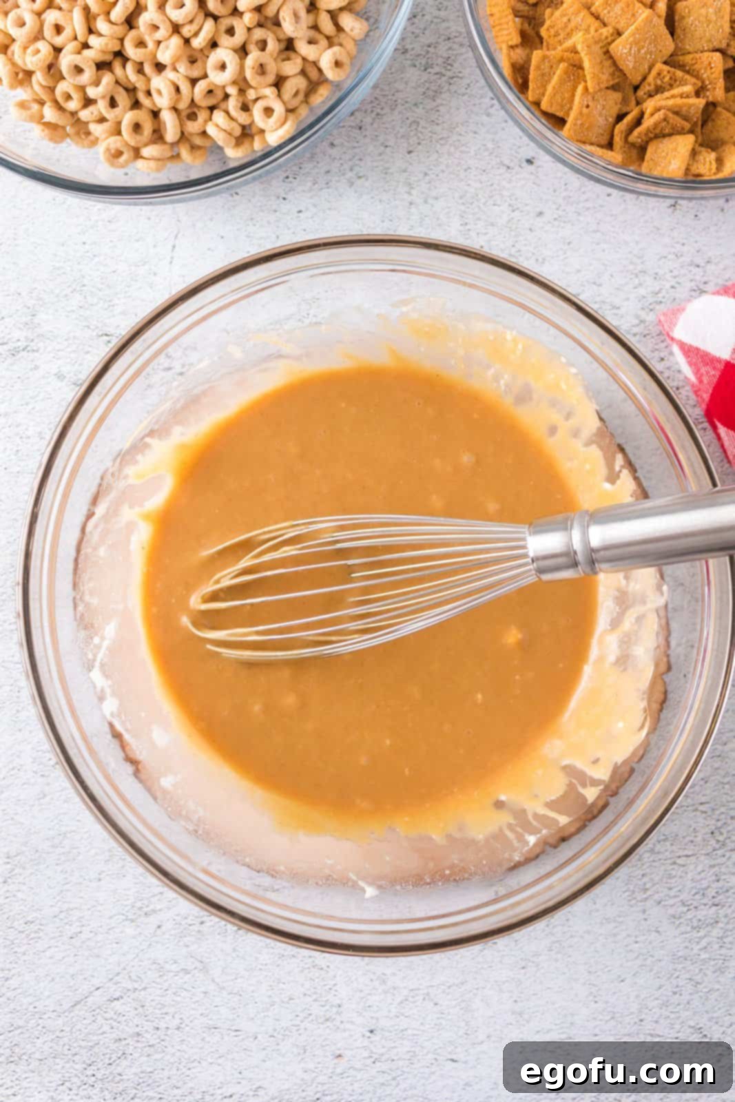 The marshmallow, honey, and peanut butter mixture perfectly whisked until smooth and fully combined in the bowl.