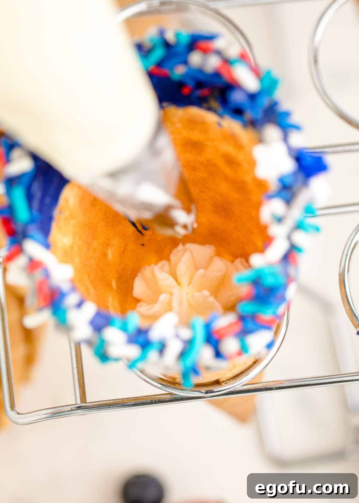 Cheesecake filling being added to cones.